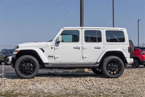 Jeep Wrangler display at a Stellantis dealership. Jeep offers the ...