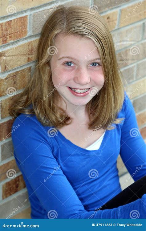 Smiling Blonde Girl With Blue Eyes Stock Photo Image