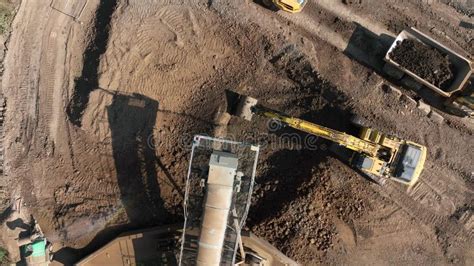 Tipper Trucks Being Loaded Up With Earth From A Conveyor Stock Footage