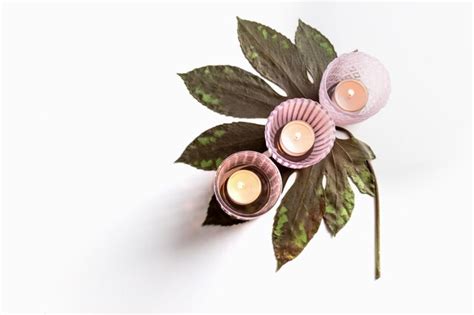 Premium Photo Pink Glass Candlesticks With Candles On A Dried