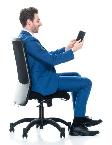 Smart Casual Man In Suit Sitting On Chair And Laughing Stock Photos