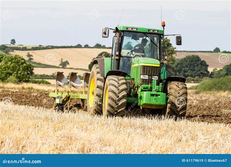 Modern John Deere Tractor Pulling A Plough Editorial Stock Image