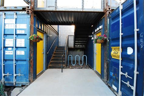 Shipping Container Apartments with Industrial Style Staircases