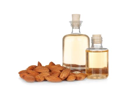 Premium Photo Perfume Bottles And Almonds On White Background
