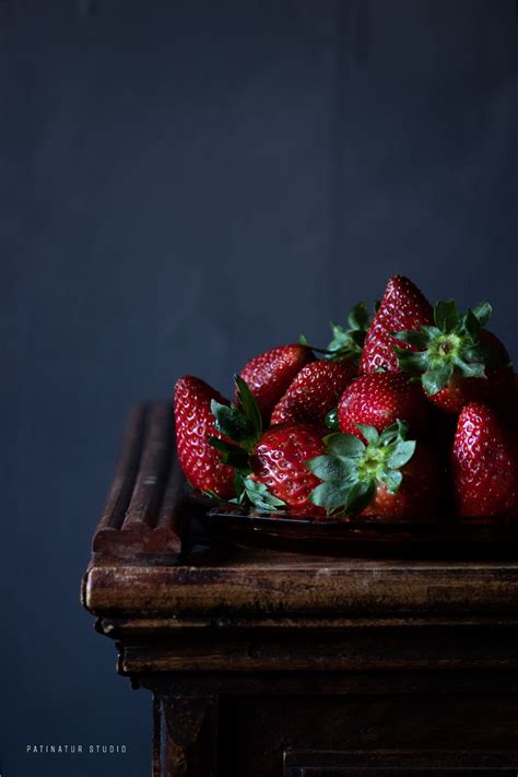 Dark And Moody Food Still Life Photo With Strawberries Inspired By