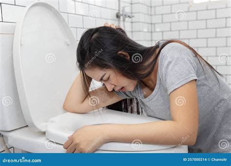 Asian Woman Vomiting Into Toilet Bowl Stock Photo Image Of Bowl