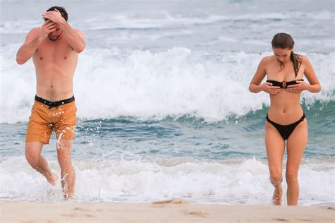 Liam Hemsworth hits the beach with model girlfriend Gabriella Brooks ...