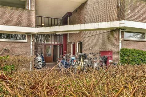 Premium Photo A Group Of Bikes Parked Outside Of A Brick Building