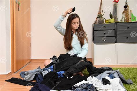 Frustrated Teenage Girl Choosing Her Outfit Stock Image Image Of Floor Expression 139050357