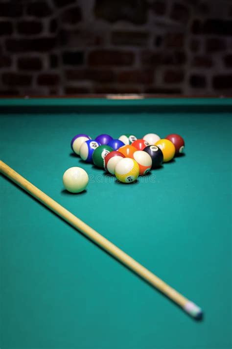 Colorful Billiard Balls Cue Ball And Cues On A Green Table Billiards