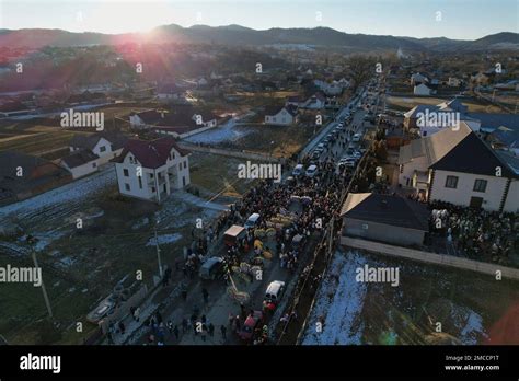 An aerial view of villagers parading the street while celebrating the ...