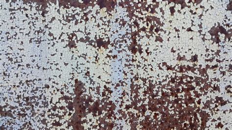 Texture Of Weathered Metal Wall With Cracked Paint And Rust Stock Photo