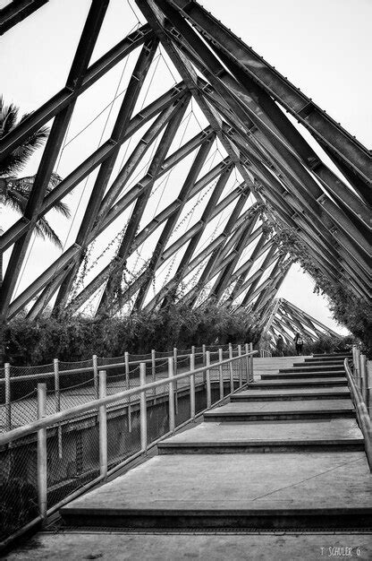 Premium Photo View Of Footbridge Against Sky