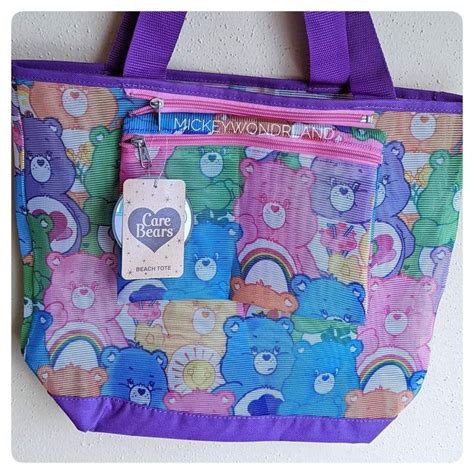 A Purple And Blue Tote Bag With Teddy Bears On It Hanging From The Wall