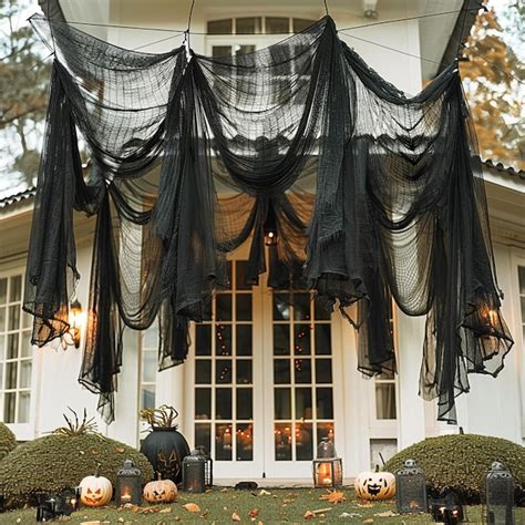 Araffe Halloween Decorations On A Porch With Pumpkins And Candles