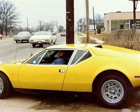 Driving His 1971 Yellow DeTomaso Pantera Sometime In 1975 Elvis