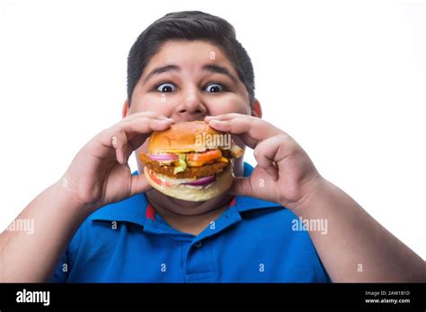 Obese Kid Eating Burger Hi Res Stock Photography And Images Alamy