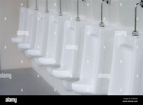 White Urinals In Men Public Toilet Ceramic Urinals In A Row In Men