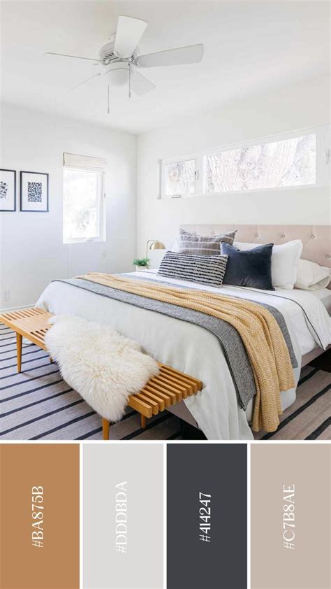 a bedroom with white walls and gray carpeted flooring is shown in the