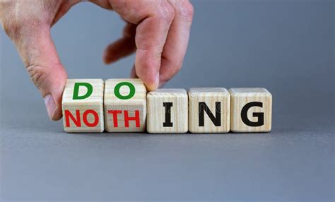 Doing or Nothing Symbol. Businessman Turns Wooden Cubes and Changes the Word Nothing To Doing ...