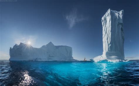 Two Giant Ice Bergs On A Body Of Water Hd Wallpaper Wallpaper Flare