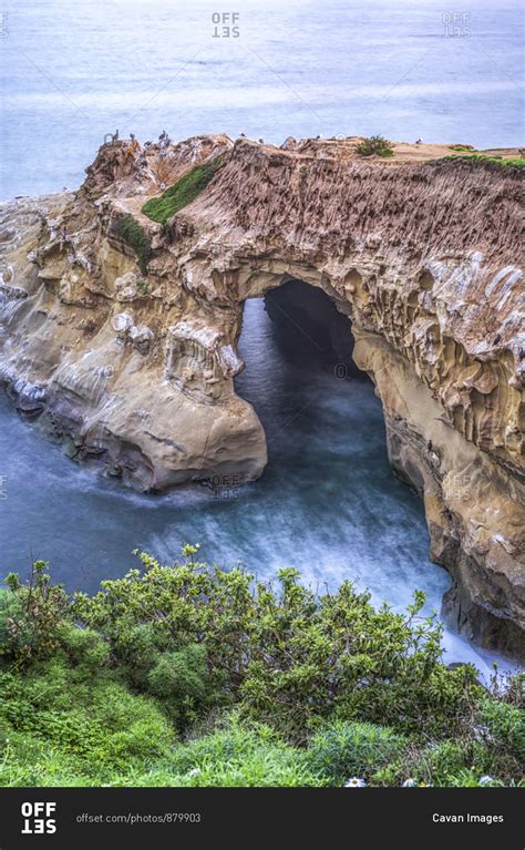 Sunny Jim Cave on the La Jolla coast. stock photo - OFFSET