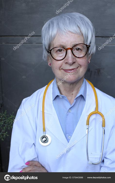 Close Portrait Mature Woman Doctor White Coat Stethoscope Grey Wall