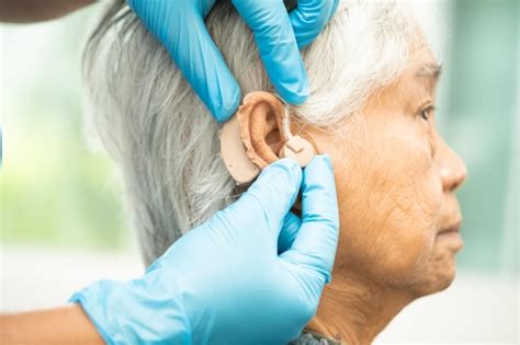 Premium Photo Asian Senior Woman Patient Wearing A Hearing Aid For