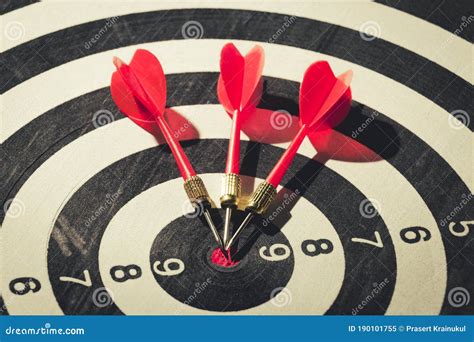 Dart Arrow Hitting In The Target Center Of Dartboard Concept Of The