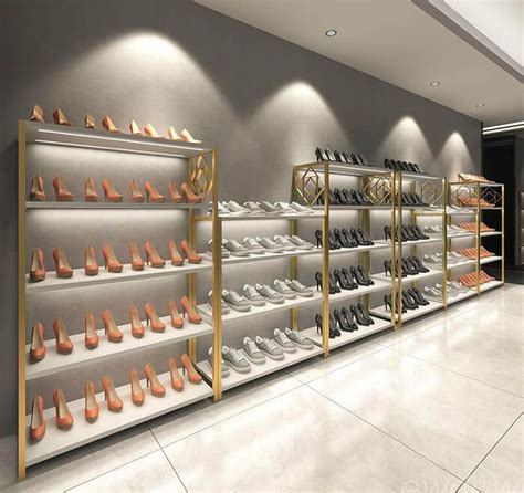 A Large Display Case Filled With Lots Of Pairs Of Shoes In Front Of A Wall