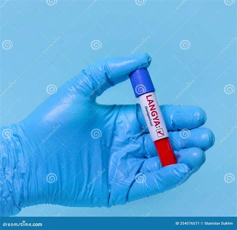 Doctor Holding A Test Blood Sample Tube Positive With Langya