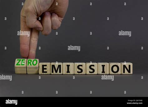 Zero Emission Symbol Businessman Turns Wooden Cubes And Changes Words