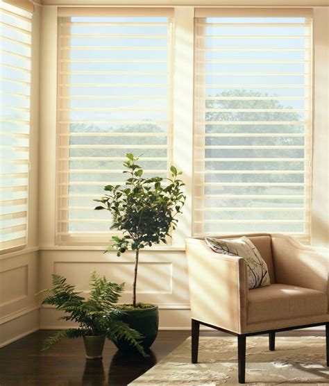 A Living Room Filled With Furniture And Windows Covered In Blinds