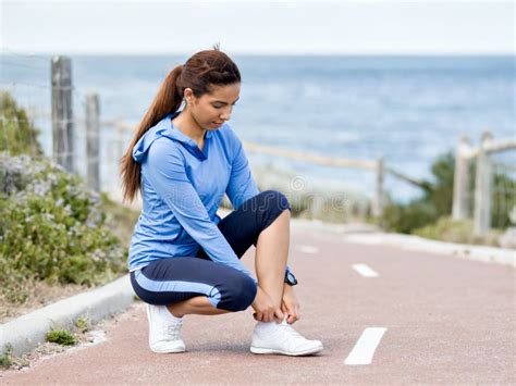 Woman Runner Tying Shoelace At The Seaside Stock Photo Image Of