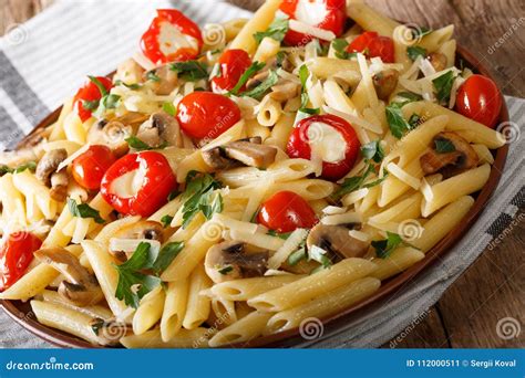 Italian Food: Penne Pasta with Mushrooms, Cherry Tomatoes, Stuff Stock ...