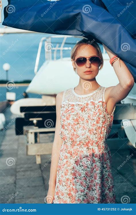 Blonde Girl In Flower Dress And Sunglasses Holding Boat Sails Stock Photo Image Of Ocean