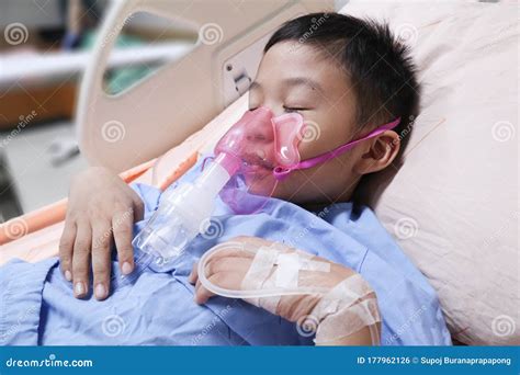 Boy Patient With Asthma Allergy Using The Asthma Inhalerinhaler Mask