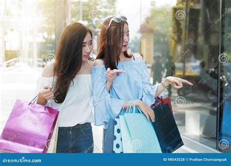 Two Happy Friends Shopping in Holiday Time. Stock Photo - Image of ...