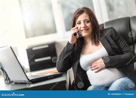 Smiling Pregnant Woman Using Mobile Phone At Office Stock Image Image