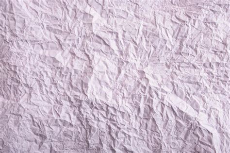 Premium Photo | Purple crumpled paper background