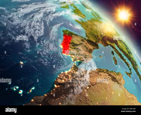 Sunrise Above Portugal Highlighted In Red On Model Of Planet Earth In