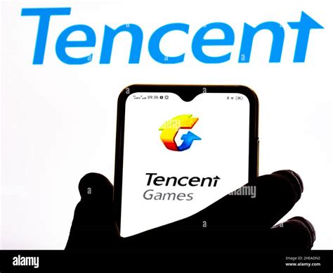 In this photo illustration Tencent Games logo seen displayed on a smartphone Stock Photo - Alamy