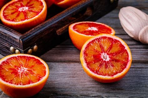 Premium Photo Sliced And Whole Ripe Juicy Sicilian Blood Oranges On