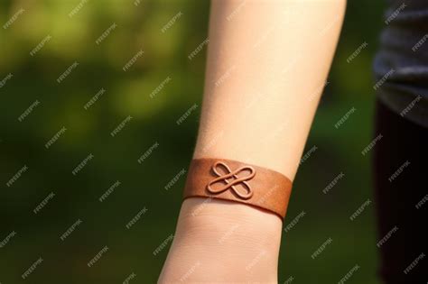 Premium Photo | A closeup of an infinity symbol tattoo on a persons wrist