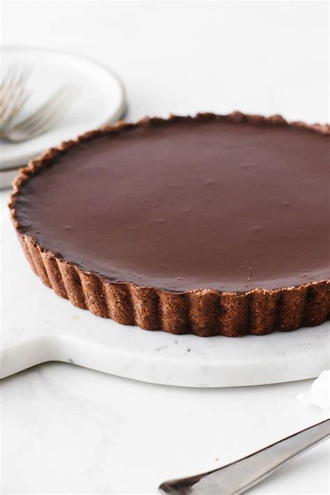 A Rich Chocolate Tart Recipe With Three Layers Of Chocolate Goodness