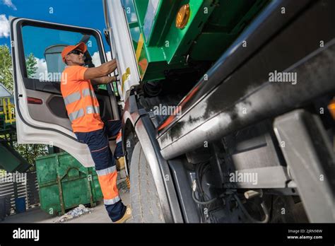 Waste Management Theme Caucasian Garbage Truck Driver In His 40s