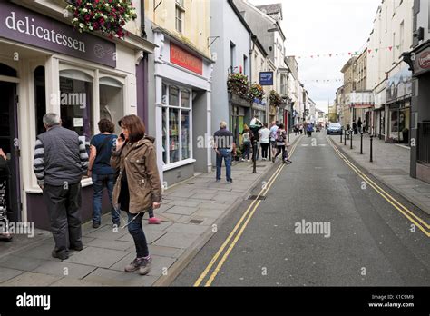 People Walking Outside A Delicatessen In King Street In Carmarthen Town