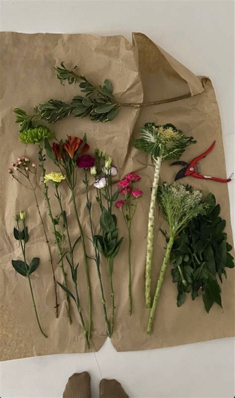 Flowers Laid Out On A Piece Of Brown Paper