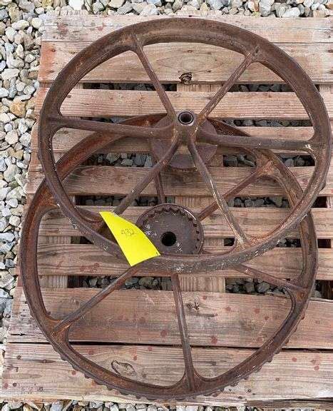 2 antique iron wheels - Schneider Auctioneers LLC