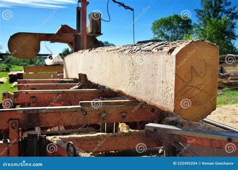 Sawing Logs On A Mobile Sawmill Log On The Sawmill Stock Photo Image